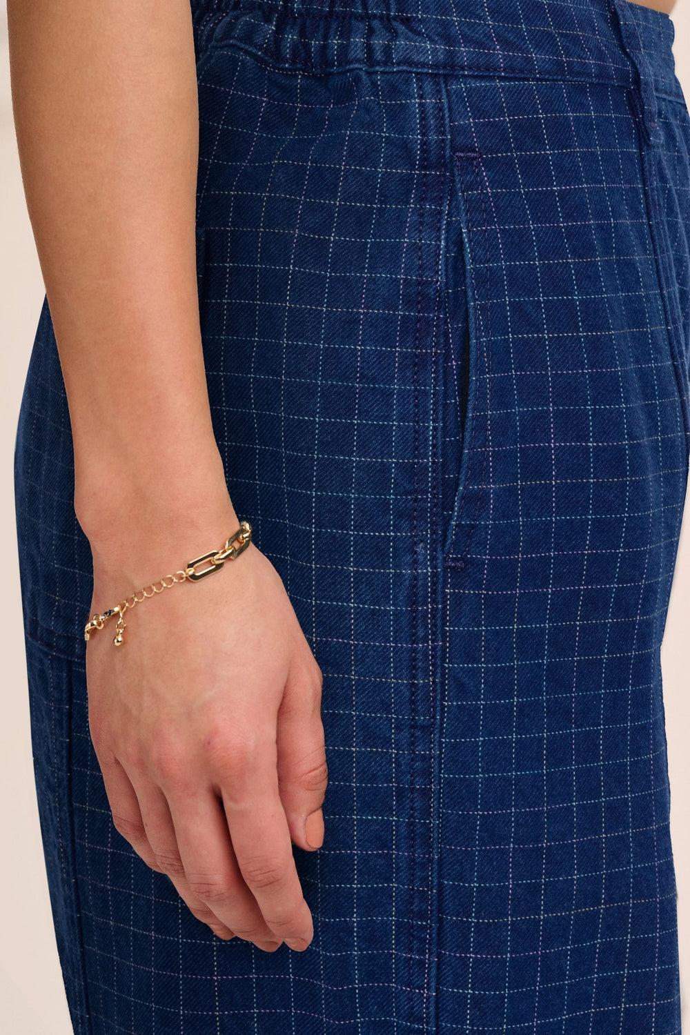 Close-up of yarn-dyed rainbow grid cotton denim