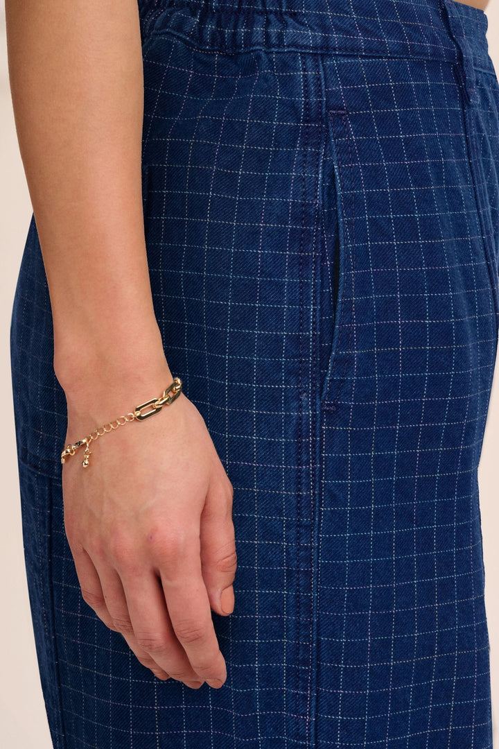 Close-up of yarn-dyed rainbow grid cotton denim