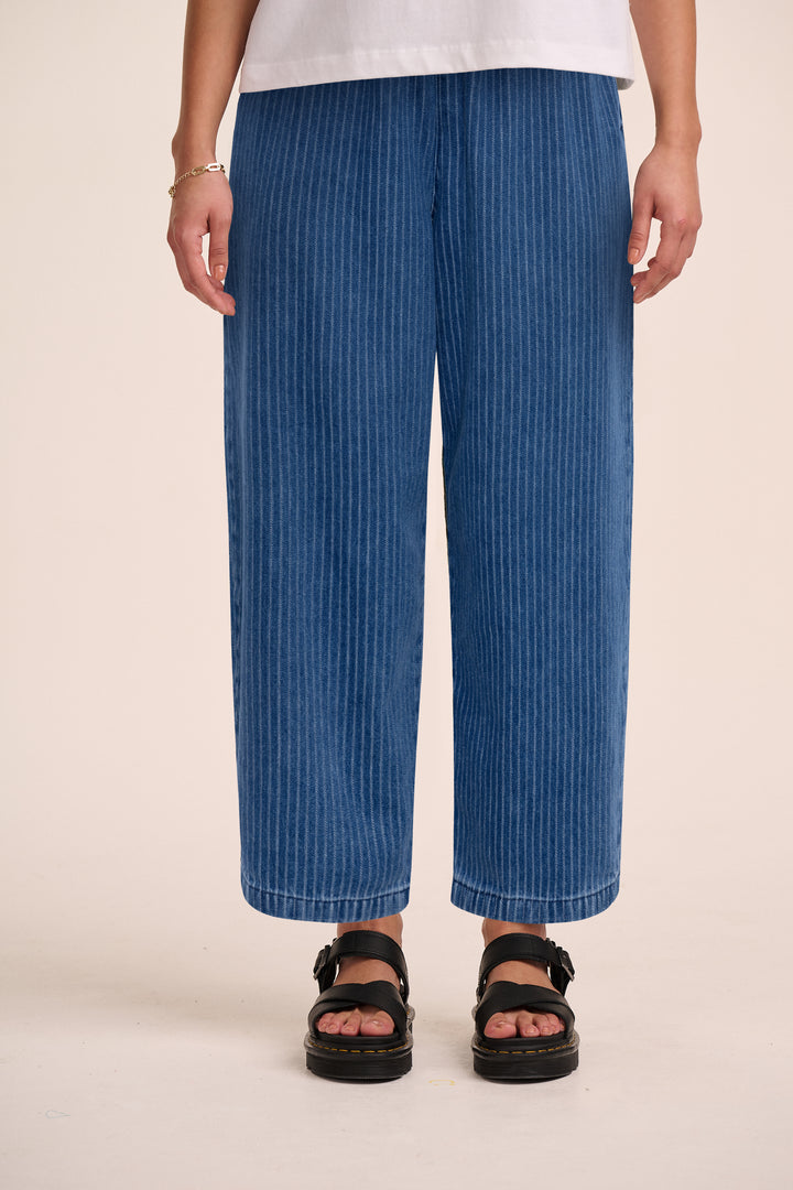 Needle stripe denim cropped trouser styled with white tee and sandals