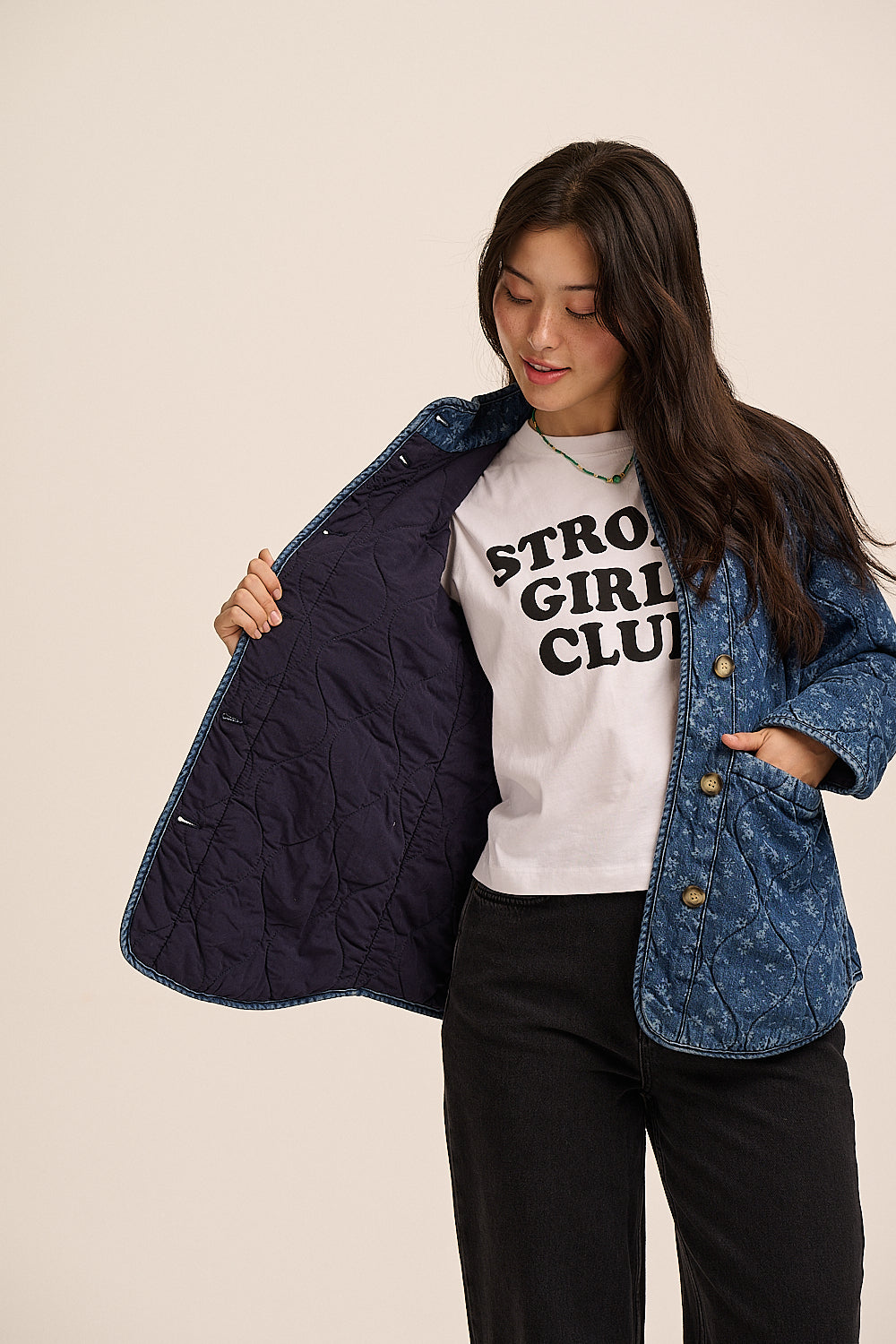 Floral quilted denim jacket open, showing navy quilted lining