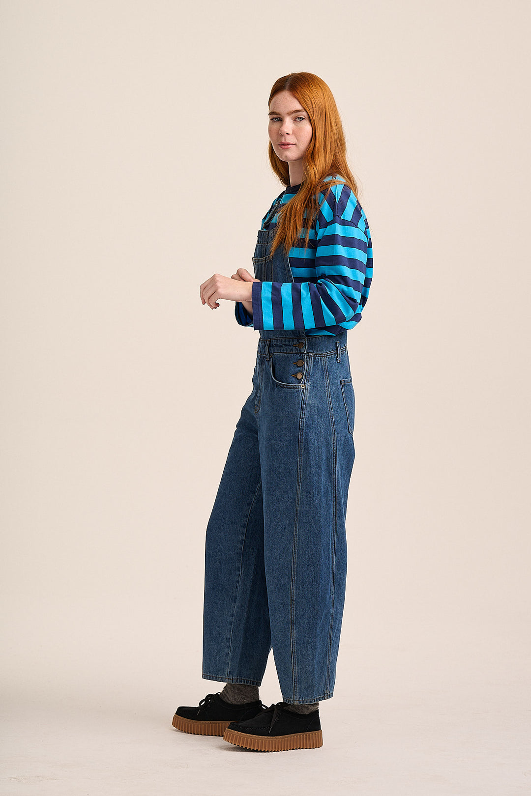 Denim dungarees styled with blue striped tee — Mutha.Hood