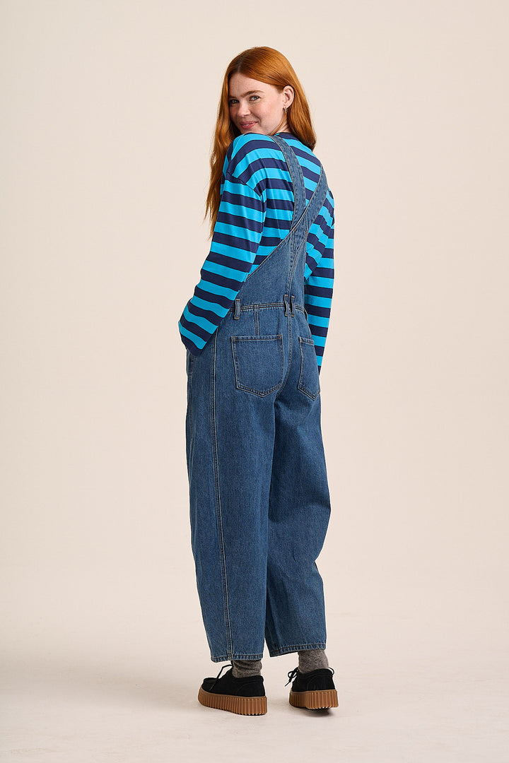 Back of Denim dungarees styled with blue striped tee — Mutha.Hood