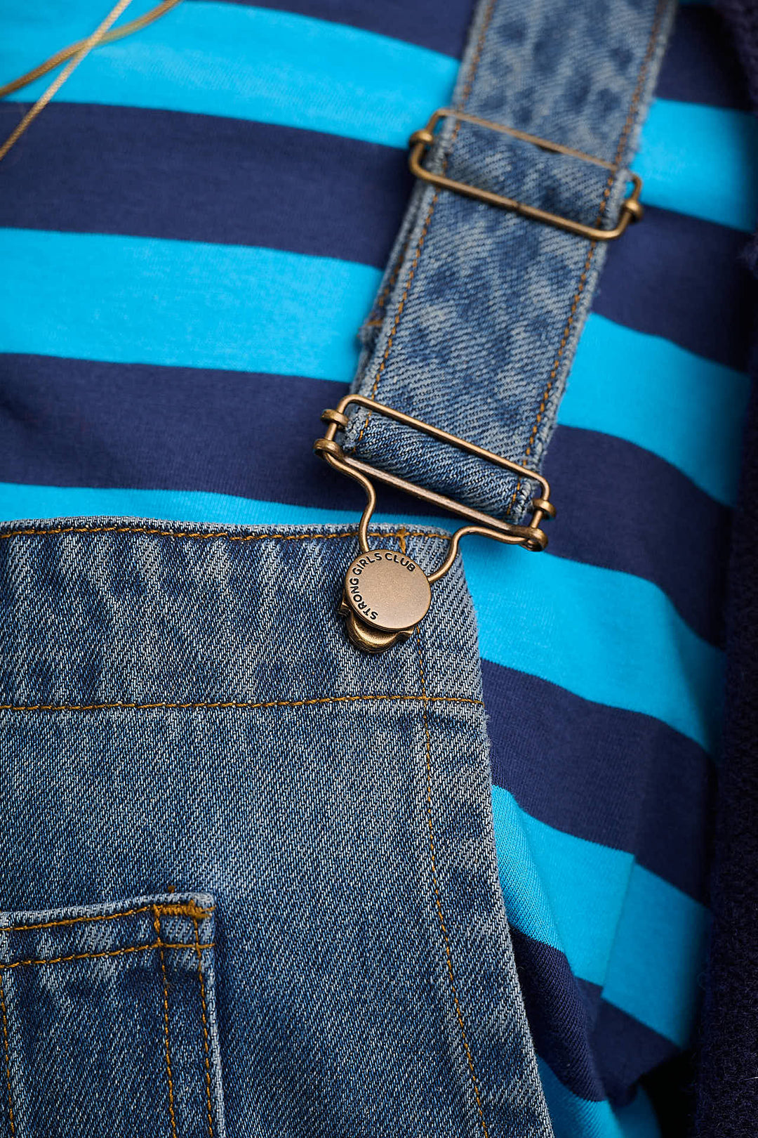 Denim dungarees styled with blue striped tee — Mutha.Hood