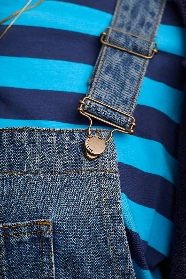 Denim dungarees styled with blue striped tee — Mutha.Hood