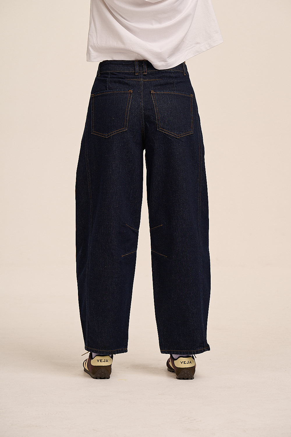 Ginny curved leg jeans front view showing knee darts and 5-pocket detail