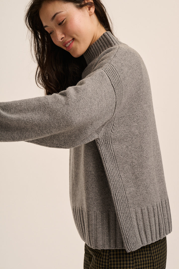 RWS merino funnel-neck jumper styled with checked trousers — Mutha.Hood